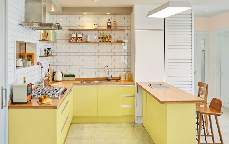 White kitchen with yellow cabinets