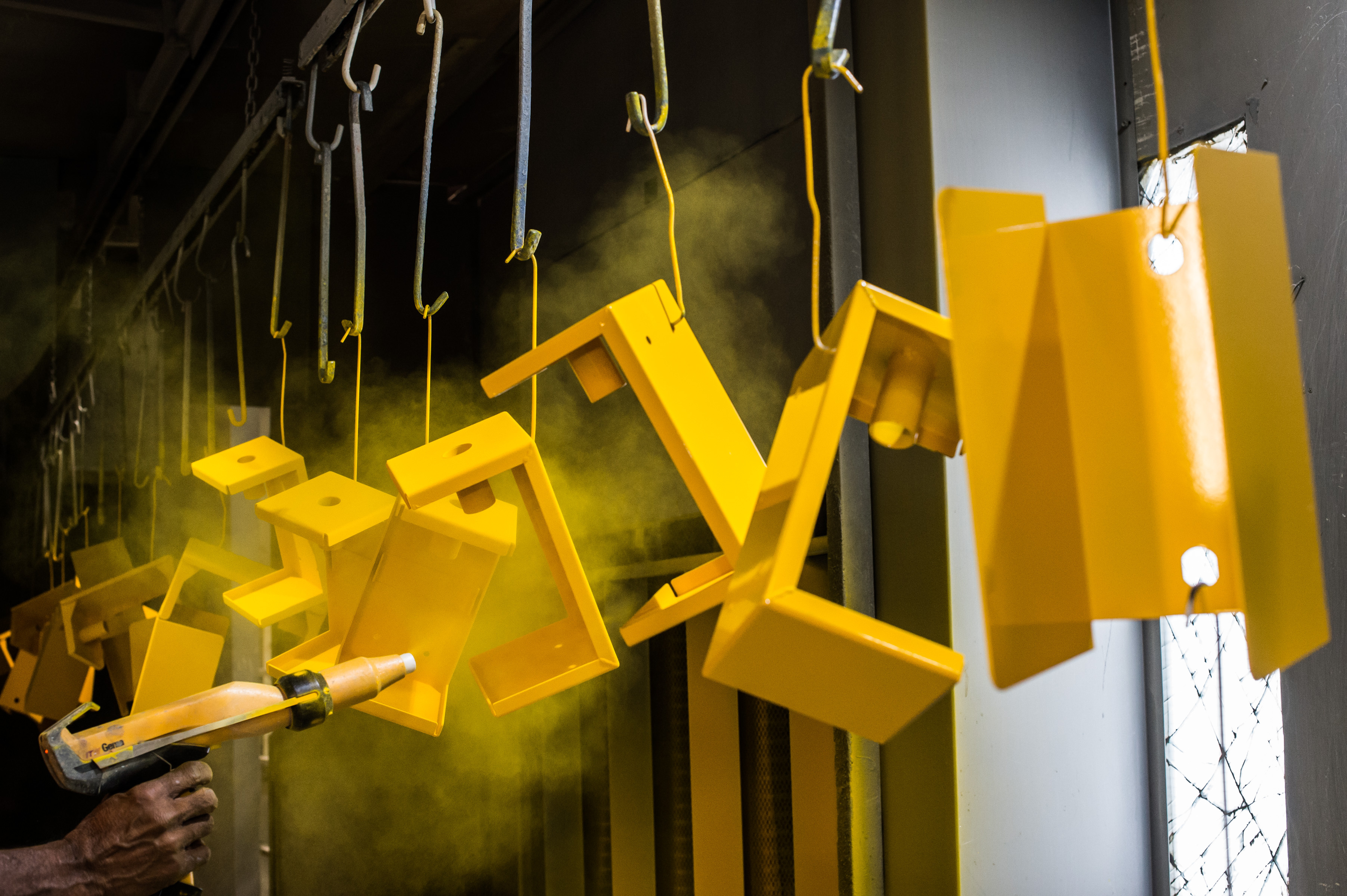 Yellow product powder coating application on metal